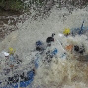 Guide Trainees Smash a Waive during Raft Guide Training