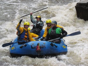 Happy rafters make it through Flip Rock Rapid on the Poudre River near Fort Collins